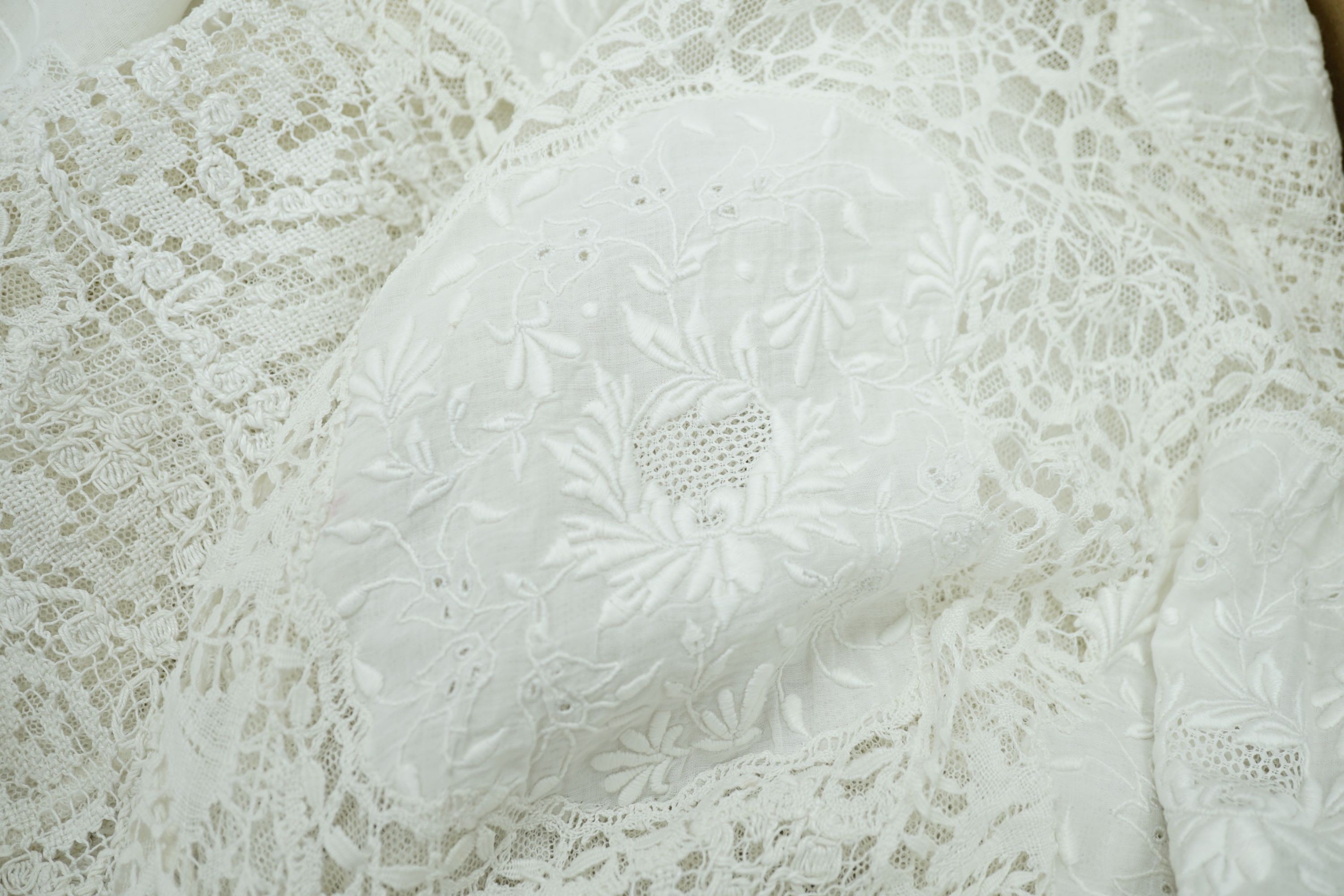 A 19th century hand made Irish crochet jacket, with long sleeves and high collar, a bobbin lace and white worked patch worked blouse, a fine lawn and anglaise worked blouse and a fine bobbin lace trimmed and white worked